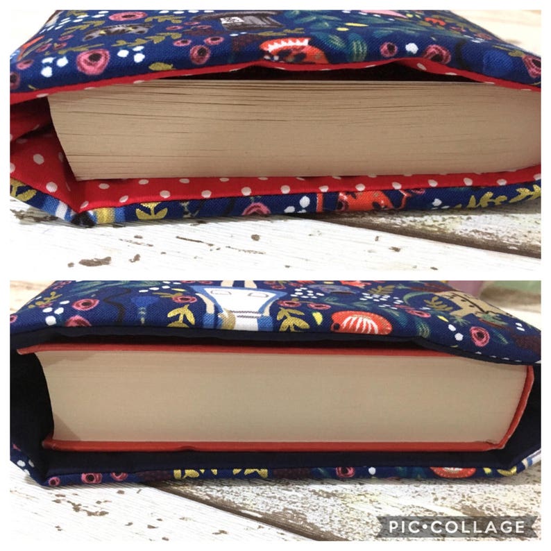 May include: A fabric book sleeve featuring a dark blue background with a colourful floral and character pattern. The top image shows a red lining with white polka dots, while the bottom image shows a solid dark blue lining holding a thick paperback book.