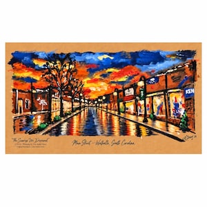 May include: A landscape art print on tan paper depicting a street scene at sunrise with vibrant orange, yellow, and blue colors. The text reads "The Sunrise We Deserved" and "Main Street - Walhalla, South Carolina" with a signature in the corner.