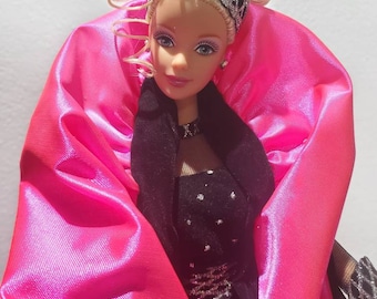 Four collectable barbies