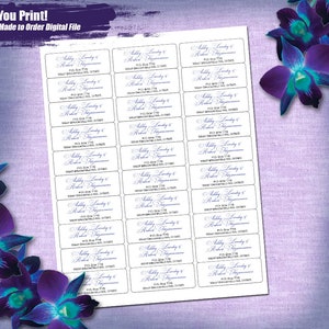 May include: A sheet of white paper with 20 address labels printed on it. The labels are rectangular and have a white background with black borders. The text on the labels is in a blue cursive font and reads "Abby Landy & Robert Figueroa, P.O. Box 778, West Brookfield, MA 01585".