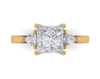 14 kt massief gouden verlovingsring voor dames - driestenen 2,32 ct. prinses geslepen saffier