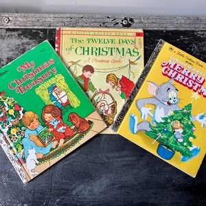May include: Three vintage Little Golden Books with Christmas themes. The books are "My Christmas Treasury", "The Twelve Days of Christmas", and "Tom and Jerry's Merry Christmas".