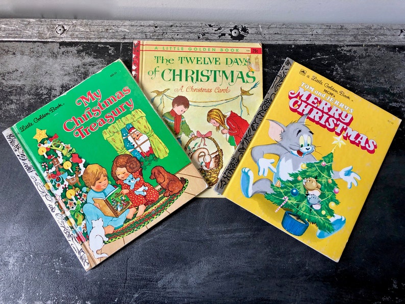 May include: Three vintage Little Golden Books with Christmas themes. The books are "My Christmas Treasury", "The Twelve Days of Christmas", and "Tom and Jerry's Merry Christmas".