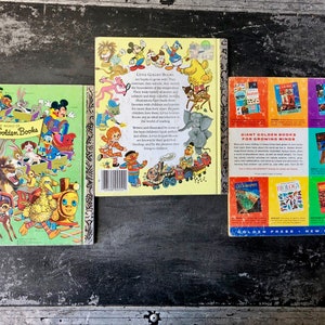 May include: Three vintage Little Golden Books with colorful covers featuring cartoon characters. The books are titled "The World of Little Golden Books", "Little Golden Books" and "Giant Golden Books for Growing Minds".