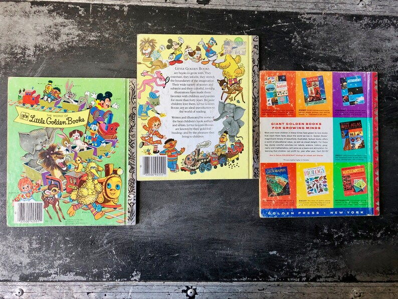 May include: Three vintage Little Golden Books with colorful covers featuring cartoon characters. The books are titled "The World of Little Golden Books", "Little Golden Books" and "Giant Golden Books for Growing Minds".