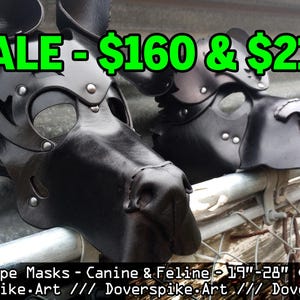 May include: Two black leather canine and feline prototype masks. The masks have a detailed design with rivets and straps. The text "SALE" is displayed in green, along with price points. The masks are designed for a 19"-28" cranium.