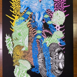 May include: A black and white print with a psychedelic design featuring a variety of creatures and patterns in shades of blue, green, yellow, and pink. The print is signed and numbered 1/100.