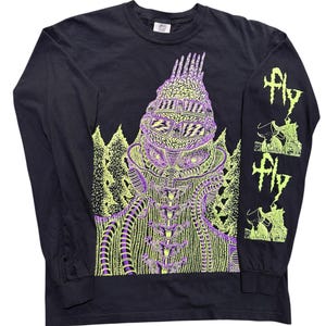May include: Black long-sleeved shirt with a neon green and purple graphic. The graphic features a detailed, stylized creature design on the front and the word "Fly" on the sleeve. The shirt has a crew neck.