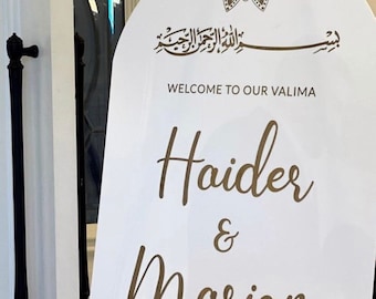 May include: White welcome sign with a gold mandala design at the top. The sign reads "Welcome to our Valima Haider & Mariam 01/23/22".