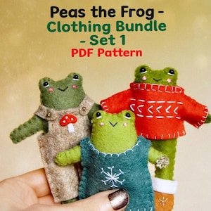 May include: Three felt frog dolls dressed in various outfits. One frog is in dungarees with a mushroom button, another in a red jumper with white details, and the third in a blue dress with a snowflake. Text reads "Peas the Frog - Clothing Bundle - Set 1 PDF Pattern."