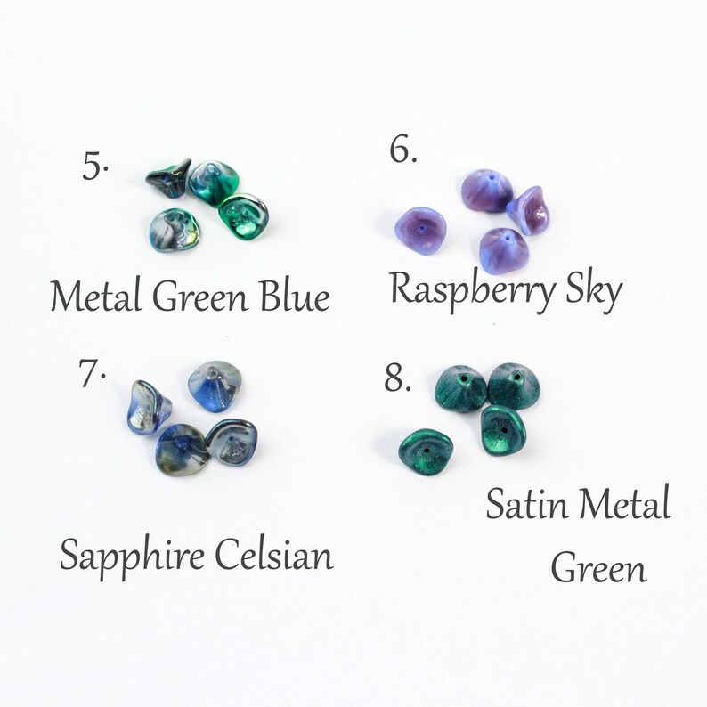 May include: Assortment of glass beads in various colors, including green, blue, and purple. The beads are arranged in groups of four, with each group labeled with a number and a descriptive name. The names include "Metal Green Blue", "Raspberry Sky", "Sapphire Celsian", and "Satin Metal Green".