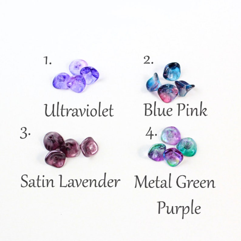 May include: Four groups of glass beads in different colors: ultraviolet, blue pink, satin lavender, and metal green purple.