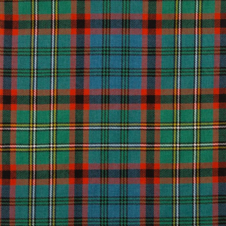 May include: A close-up of a tartan fabric with a repeating pattern. The design features a grid of intersecting lines in teal, green, red, black, white, and yellow. The fabric has a woven texture.
