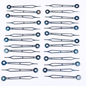 May include: Twenty black clock hands with a blue tint. The hands are arranged in rows on a white background.
