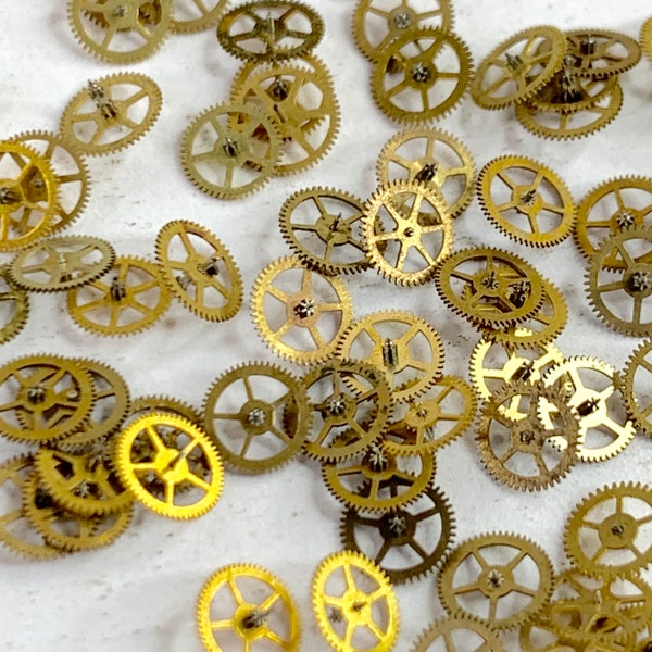 25 Gold Watch Wheels 4mm Tiny altered art parts Gears steampunk watchmaker lot