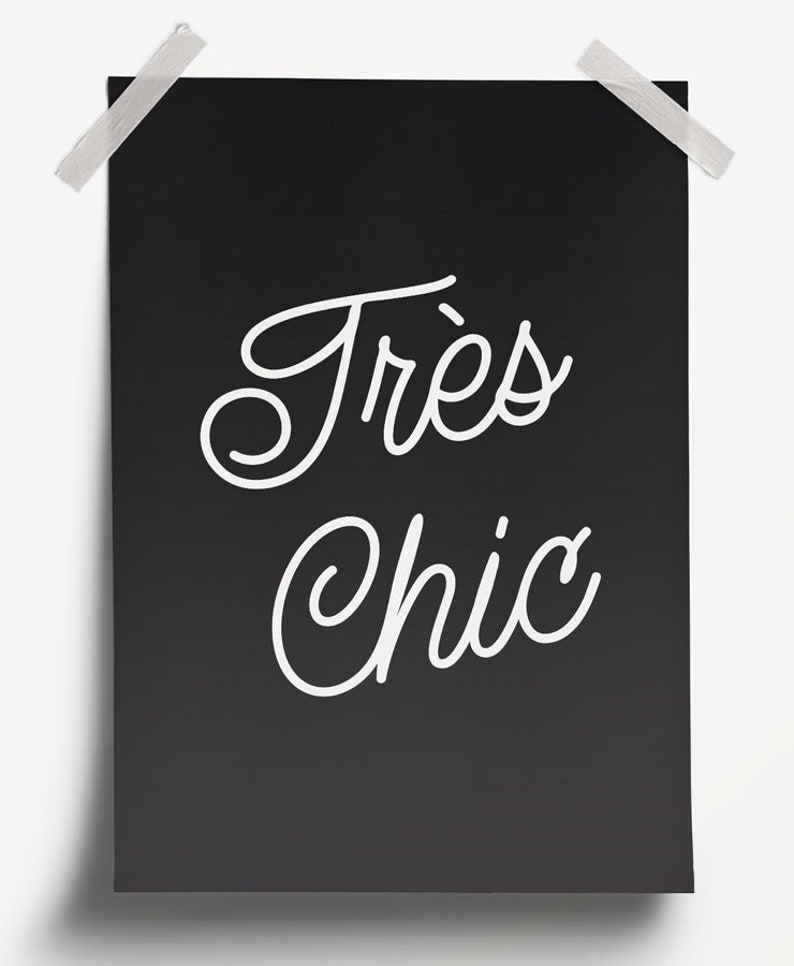 May include: A black and white poster with the text "Tr&egrave;s Chic" in a cursive font.