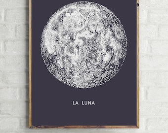 May include: A black and white illustration of the moon with the text "LA LUNA" printed below it.