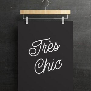May include: A black and white printable wall art print with the text "Tr&egrave;s Chic" in a cursive font.