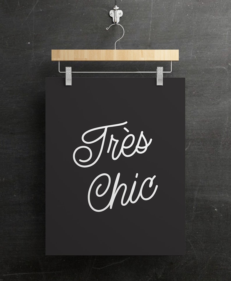 May include: A black and white printable wall art print with the text "Tr&egrave;s Chic" in a cursive font.
