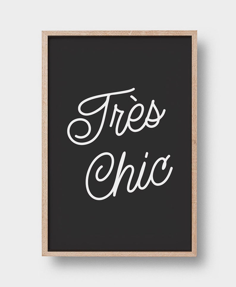 May include: Black and white framed print with the text "Tr&egrave;s Chic" in a cursive font.
