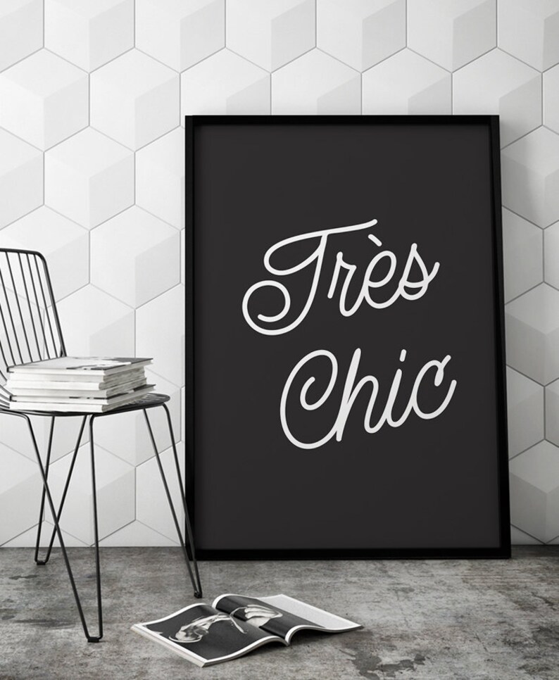 May include: Black and white framed print with the text "Tr&egrave;s Chic" in a cursive font.