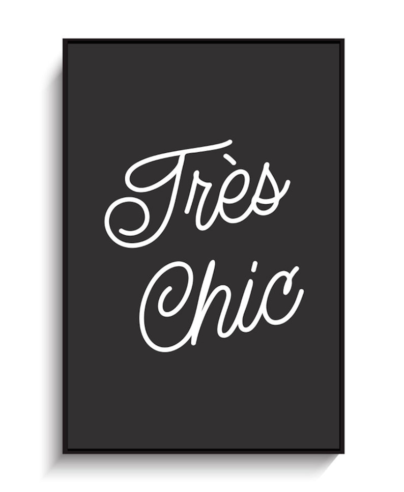 May include: Black and white typography print with the text "Tr&egrave;s Chic" in a cursive font.