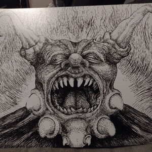 May include: A black and white pen and ink drawing of a grotesque, demonic creature with a wide open mouth, sharp teeth, and horns. The creature has a textured, detailed design.