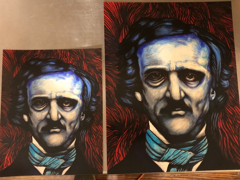 May include: A black and white illustration of Edgar Allan Poe with a blue and white patterned scarf. The background is red and black.