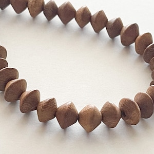 Philippine Robles Saucer Beads: Natural Wood, 10x7mm Strand