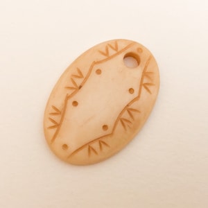 Carved Bone Pendant