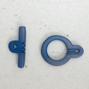 One set carved bone toggle blue