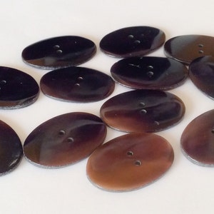 12 Black oval shell buttons for crafts and accessories