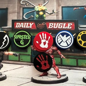 May include: A set of 6 round, colorful tokens with various symbols and text. The tokens include a black and white lightning bolt, a green and white circle with the text "Sinister 6", a red handprint, a blue shield with a white bird, a yellow sun with black rays, and a red handprint with black lines.