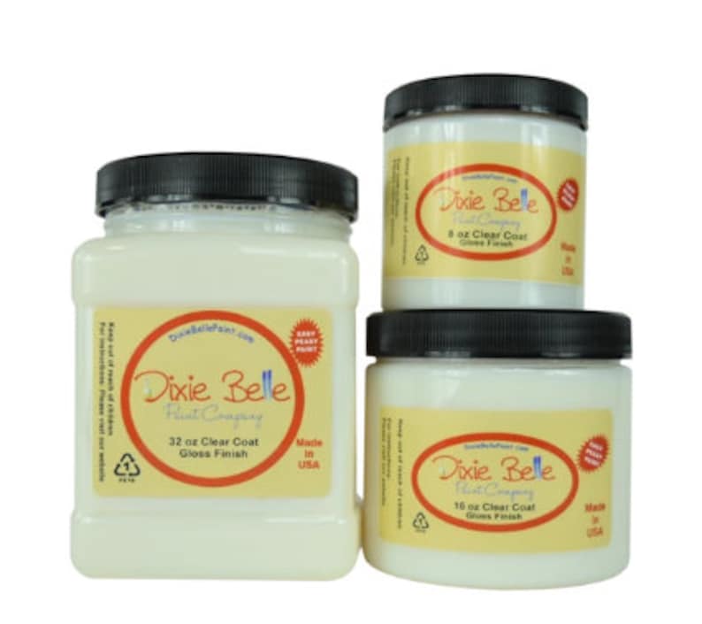 May include: Three white jars of Dixie Belle Paint Company clear coat in gloss finish. The jars are labeled with the size in ounces: 8 oz, 16 oz, and 32 oz. All jars are made in the USA.