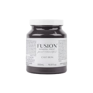 May include: A 500ml bottle of Fusion Mineral Paint in the colour Cast Iron. The bottle is a dark grey colour and has a white label with the Fusion logo and product information.
