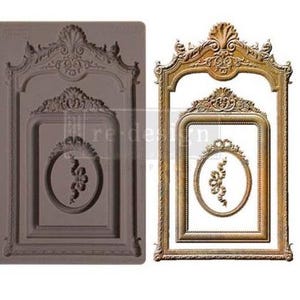 May include: A silicone mold for creating a decorative frame with an ornate design. The mold is brown and features a double frame with a smaller oval frame inside. The mold is designed to create a decorative element for crafts and home decor.