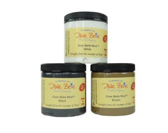 May include: Three jars of Dixie Belle Mud paint in white, black, and brown. The jars are labeled with the Dixie Belle logo and the color of the paint.