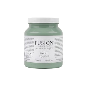 May include: A 500ml bottle of Fusion Mineral Paint in the colour French Eggshell. The bottle is green and has a white label with the Fusion logo and the paint colour name.