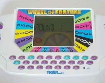 Wheel of Fortune Handheld Electronic Game TIGER 1995 WORKS Vintage Collectible