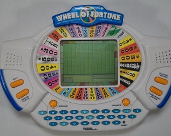 Tiger Electronics Wheel of Fortune Handheld Electronic Game 1998 retro vintage collectible lcd