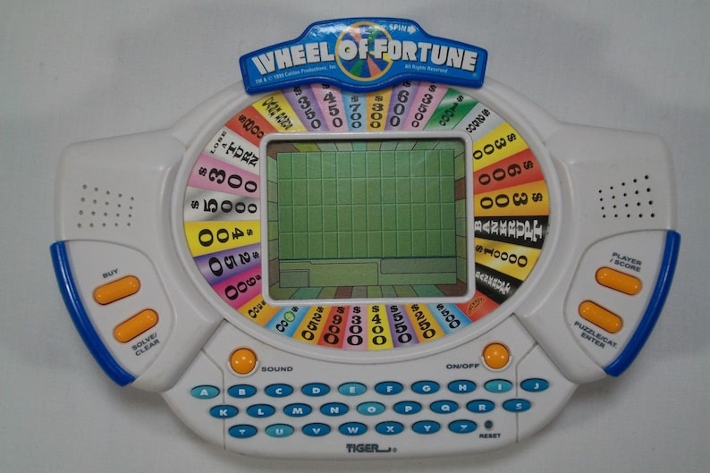 Tiger Electronics Wheel of Fortune Handheld Electronic Game Etsy