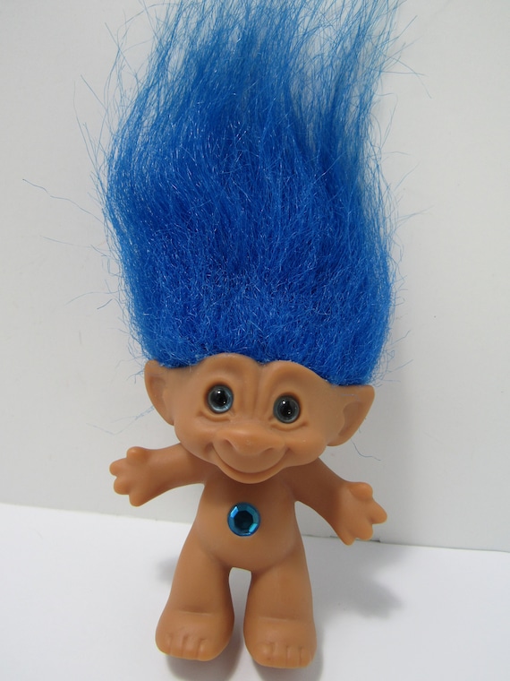 troll doll with gem in belly