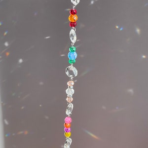 Crystal sun catcher stand with the leaf style prism end