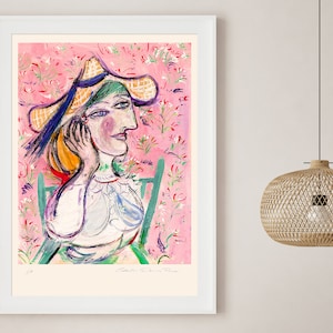 May include: A colorful painting of a woman wearing a straw hat and a white blouse. The background is a pink floral pattern.
