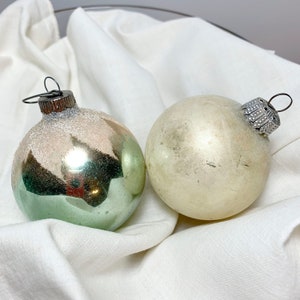 Set of 2 Ornaments: One white, One green w/leaf detail