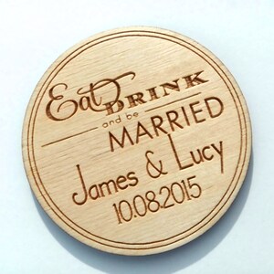 May include: A round wooden coaster with the text "Eat Drink and be Married" and the names "James & Lucy" and the date "10.08.2015" engraved on it.