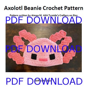 May include: A pink crocheted axolotl beanie hat with black eyes. The pattern is available for download as a PDF.