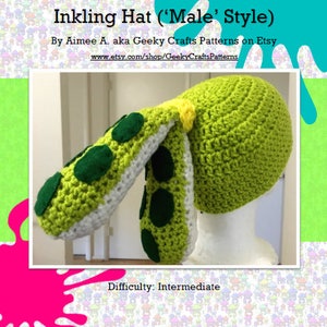May include: Green crocheted hat with a long, white and green tentacle-like appendage. The hat is on a white mannequin head. The text "Inkling Hat ('Male' Style)" and "Difficulty: Intermediate" is visible in the image.