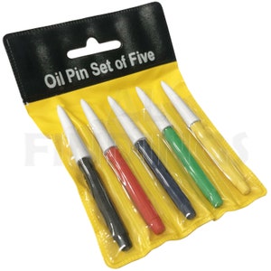 May include: A set of five oil pins in a yellow and black package. The pins are black, red, blue, green, and yellow. The package says "Oil Pin Set of Five".