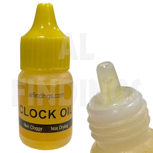 May include: A small yellow bottle with a clear dropper top. The bottle is labeled "CLOCK OIL" and says "Non Cloggy" and "Non Drying" on the label. The bottle is from alfindings.com.
